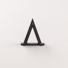 Load image into Gallery viewer, A black triangle wall rack
