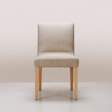 Load image into Gallery viewer, An Alpha Dining Chair available in Bandana Putty and Semi-Limewash colours
