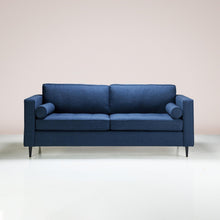 Load image into Gallery viewer, A Bolster Sofa upholstered in midnight-colored fabric
