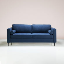 Load image into Gallery viewer, A Bolster Sofa upholstered in midnight-colored fabric