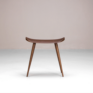 A Juno Stool available in coffee or black, made of solid ash wood