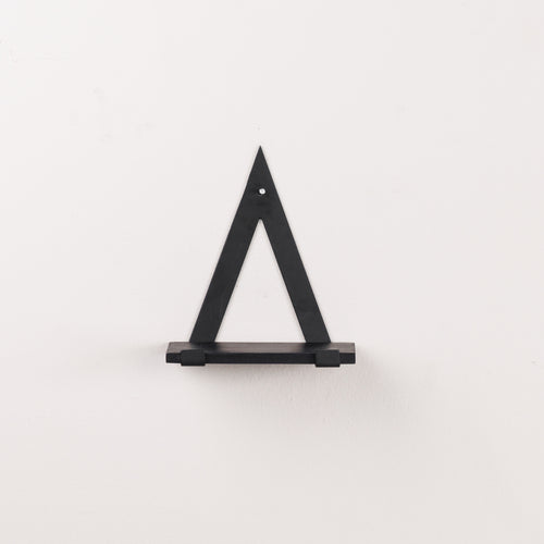 A black triangle wall rack