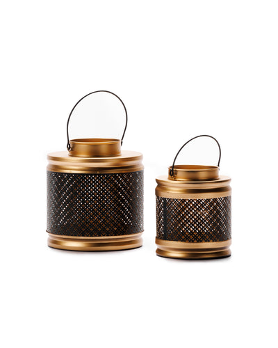 A metal cylinder lantern in black and gold colour