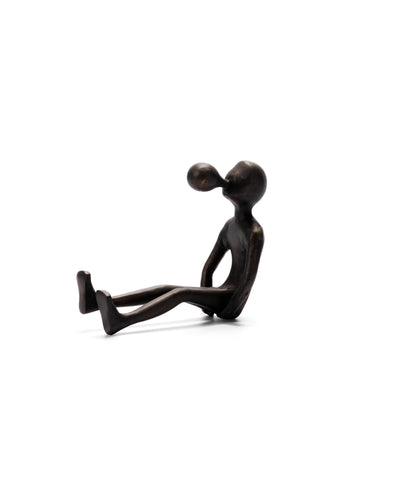 A black aluminum bubble man figurine