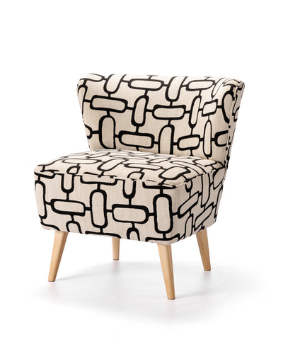 A Coco Occasional Chair in dawn colour, featuring fabric upholstery and ash wood frame and legs
