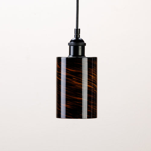 Lava glass pendant light with white, orange colors and a black cord, made of glass and metal