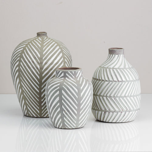 A Terracotta striped vase. Available in small, medium, and large