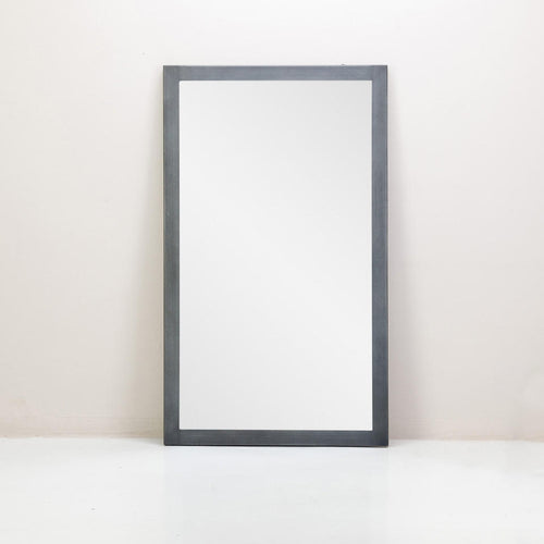 An Alto Standing Mirror with a metal frame in grey colour