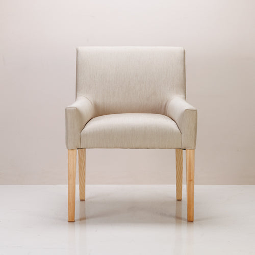 An Alpha Dining Carver Chair in Bandana Putty colour with Semi-Limewash finish