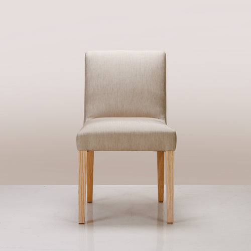 An Alpha Dining Chair available in Bandana Putty and Semi-Limewash colours