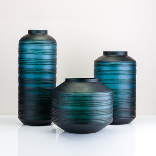 A cylinder glass vase available in small, medium, and large sizes