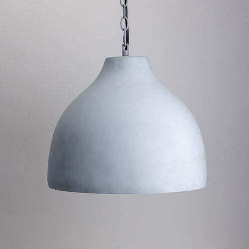 A grey dome concrete pendant light