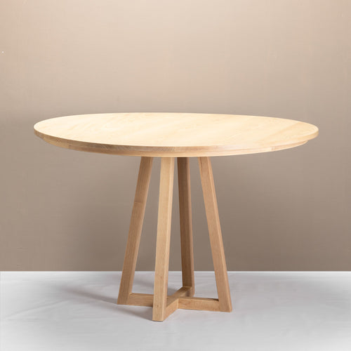 An Enzo Round Table made of solid wood ash