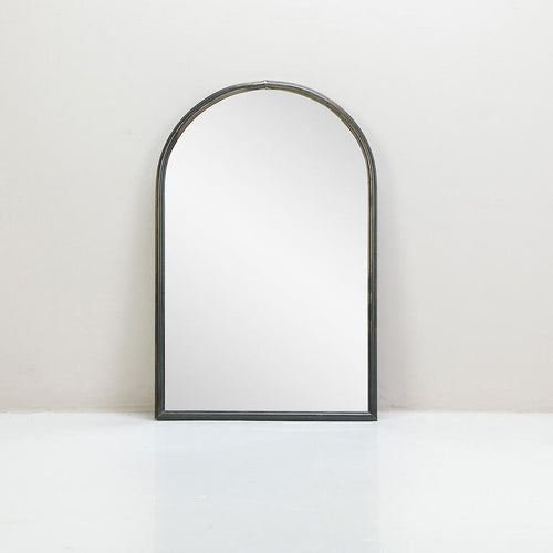 An arched mirror with metal trim, featuring a black finish