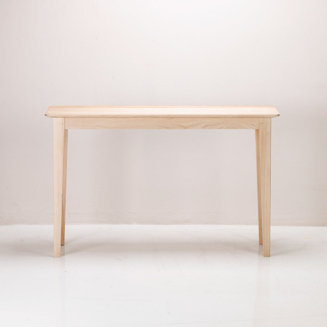 A Copenhagen Console made of solid ash wood with a semi-lime wash colour